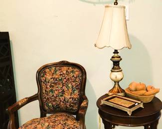 Upholstered arm chair, carved mahogany side table