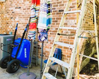 Stand up umbrellas, tall paint ladders and Kobalt Wheel Barrow