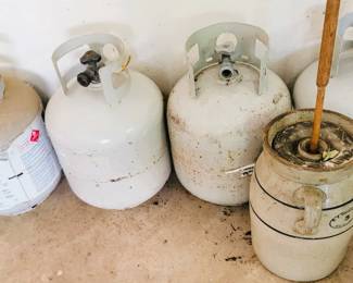 Propane tanks - full and empty. Butter churner
