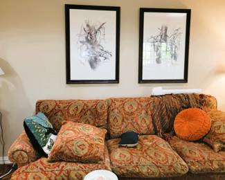 Sofa and framed lithographs