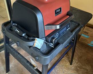 Ninja Woodfire 7-in-1 Outdoor Grill and Smoker. It is an electric-powered grill that uses wood pellets to create a smoky flavor.