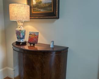 Tobacco leaf lamp and antique Demi lune cabinet