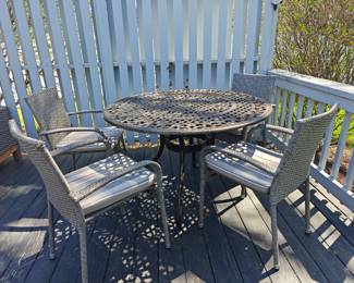 #134 Round Metal Patio Table 48 x 30 x 30 #135 4 Gray All Weather Wicker Chairs w/ Cushions 22 x 22 x 34