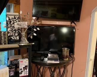 Televisions and ornate tables