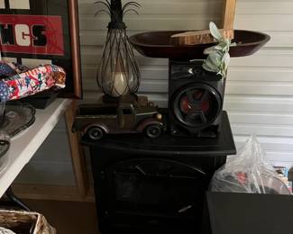 Faux fireplace heater, speakers, and decor