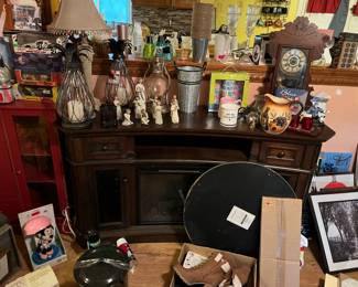 Willow figures, faux fireplace, and assorted lamps and treasures