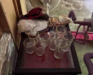 Glasses, hats, and display case tables