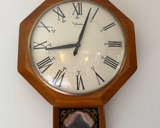 Glass faced wall clock