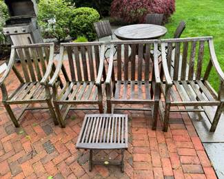 Four Teak chairs and a small table