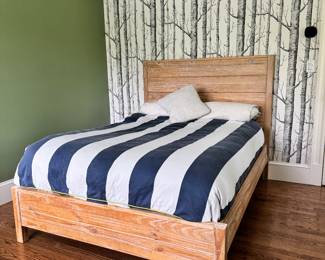 Full-size natural wood bed