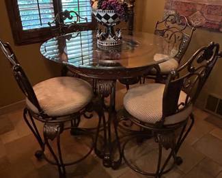 Metal, glass and wood dining table and chairs.