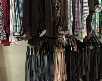 Closets filled with men’s clothing and accessories.
