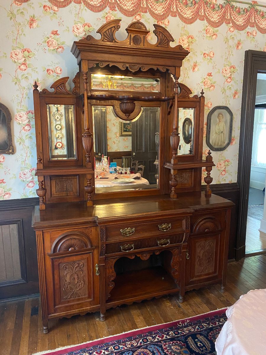 Victorian sideboard with four beveled glass mirrors & much ornate carving.