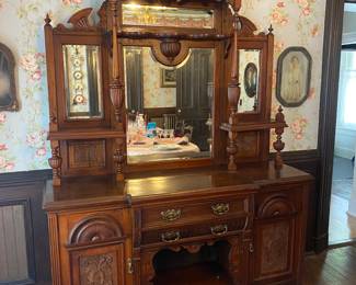 Victorian sideboard with four beveled glass mirrors & much ornate carving.