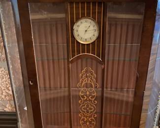 Vintage china cabinet with clock