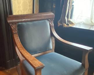 Victorian rocker with powder blue upholstery, claw feet & acanthus leaf detail