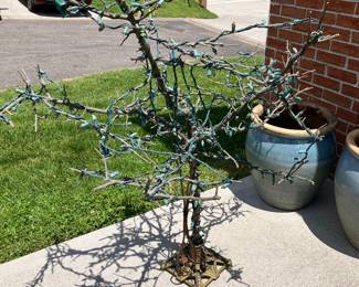 Vintage Christmas decor tree with antique cast-iron base