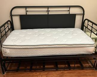 Black metal trundle bed with like new mattress