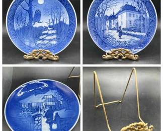 Three plates: Winter Twilight, The Queen's Christmas Residence, and The Royal Copenhagen Marselisborg Palace 1975 Christmas plate designed by Kaj Lange.