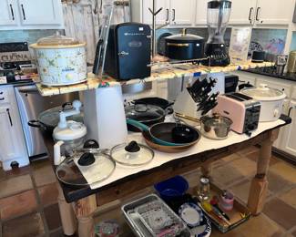 RUSTIC KITCHEN TABLE FULL OF SMALL APPLIANCES
