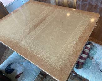 metal top on antique table