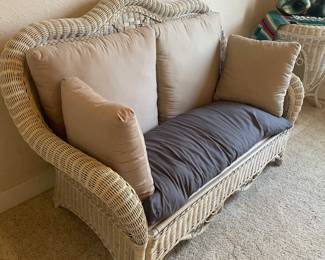 wicker sofa and round side table