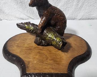 METAL BEAR ON WOOD