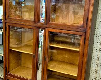 Antique Birds Eye Maple display cabinet w/ 4 glass doors over drawers. Adjustable maple shelves allows for displaying of all types of collectibles!!