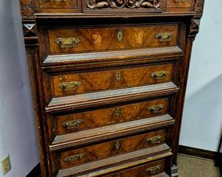 Ca. late 1800's antique Victorian Eastlake-style chest of drawers. This walnut with 6 burl-front highboy-style chest also features hand carved top drawer all w/ original brass handles  