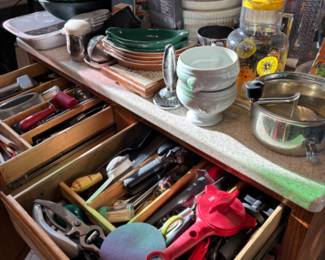 Drawers of kitchen utensils and tools