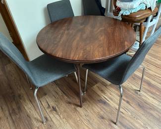 Round folding table and (4) chairs (sold separately)