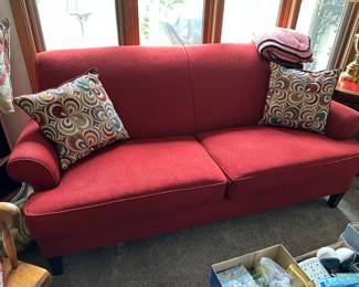 Red upholstered sofa