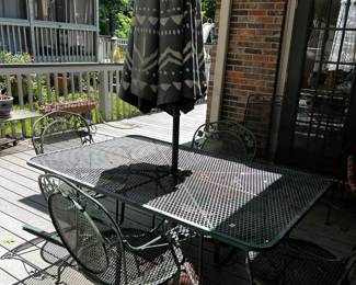 #31 Green Wrought iron Table w/Umbrella and Stand and 4 bouncy Chairs - 60x38x29 $175.00