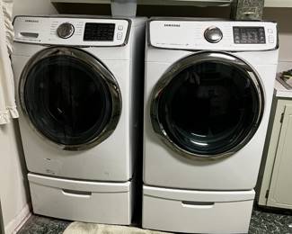 #115 Samsung front load washer and dryer on stand steam $600.00