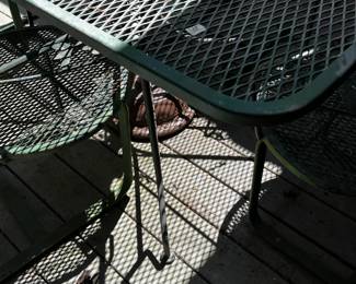 #31 Green Wrought iron Table w/Umbrella and Stand and 4 bouncy Chairs - 60x38x29 $175.00
