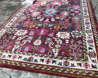 #106 machine rug red cream 94x132 $100.00