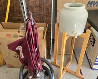 Vintage Royal vacuum with attachments, water dispenser on stand