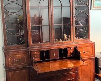 Antique mahogany 2 piece Breakfront with glass doors drawer in the middle folds down to a desk. Plenty of storage
82h x 59 w x 13d
