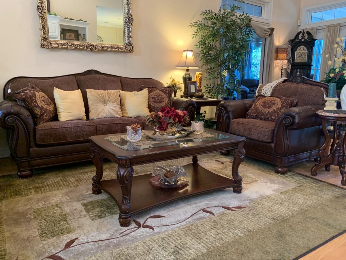 Faux leather and cloth sofa and chair, wooden and glass coffee table