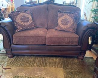 Faux leather and cloth loveseat