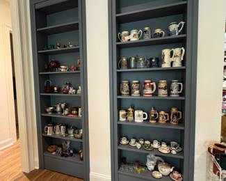 Book cases full of beer steins and collectibles