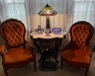 Victorian Parlor Chairs with Marble Top Parlor Table, Bradley & Hubbard Lamp Base with Signed Nelson Stained Glass Dragonfly Shade.