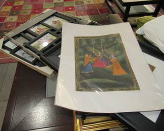 assorted artwork and picture frames