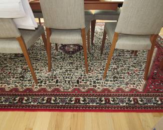 Calligaris dining room chairs. one of many nice rugs.