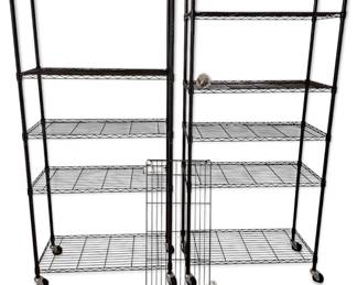 Two Tall Black Rolling Metal Shelves