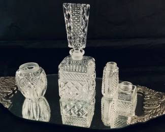 Godinger Silver Art Handled Mirrored Oval Vanity Tray shown with a World’s Finest Imperialux, West Germany Hand Cut Crystal Perfume Bottle with Stopper and Various Hand Cut Lead Crystal Bottles with missing lids