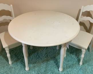 Londyn Modern Solid Wood Vanilla Finish Kids' Table and 2 Chairs Set. Perfectly sized for work and play, Constructed of solid pine with a white paint finish, round tabletop, and scalloped ladderback chairs both with trned legs.