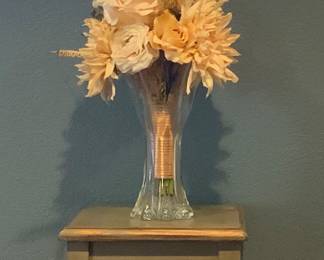 Ornate Wood Frame Mirror (22” x 31”). Cottahe Craht Green Stained Plant Stnd (30”H x 12” Square)shown with a Boquet of cream roses, peonies, etc. accented with wheat wrapped in Hemp Twine displayed in a Clear blown Art Glass Vase
