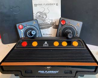 Atari flashback six classic game console with built in 100 game instruction manual model # AR2 680- 2015)
