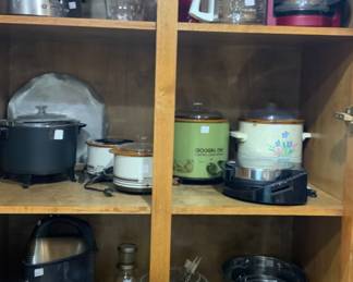 Cabinet showing various appliances, mixing boats, etc.